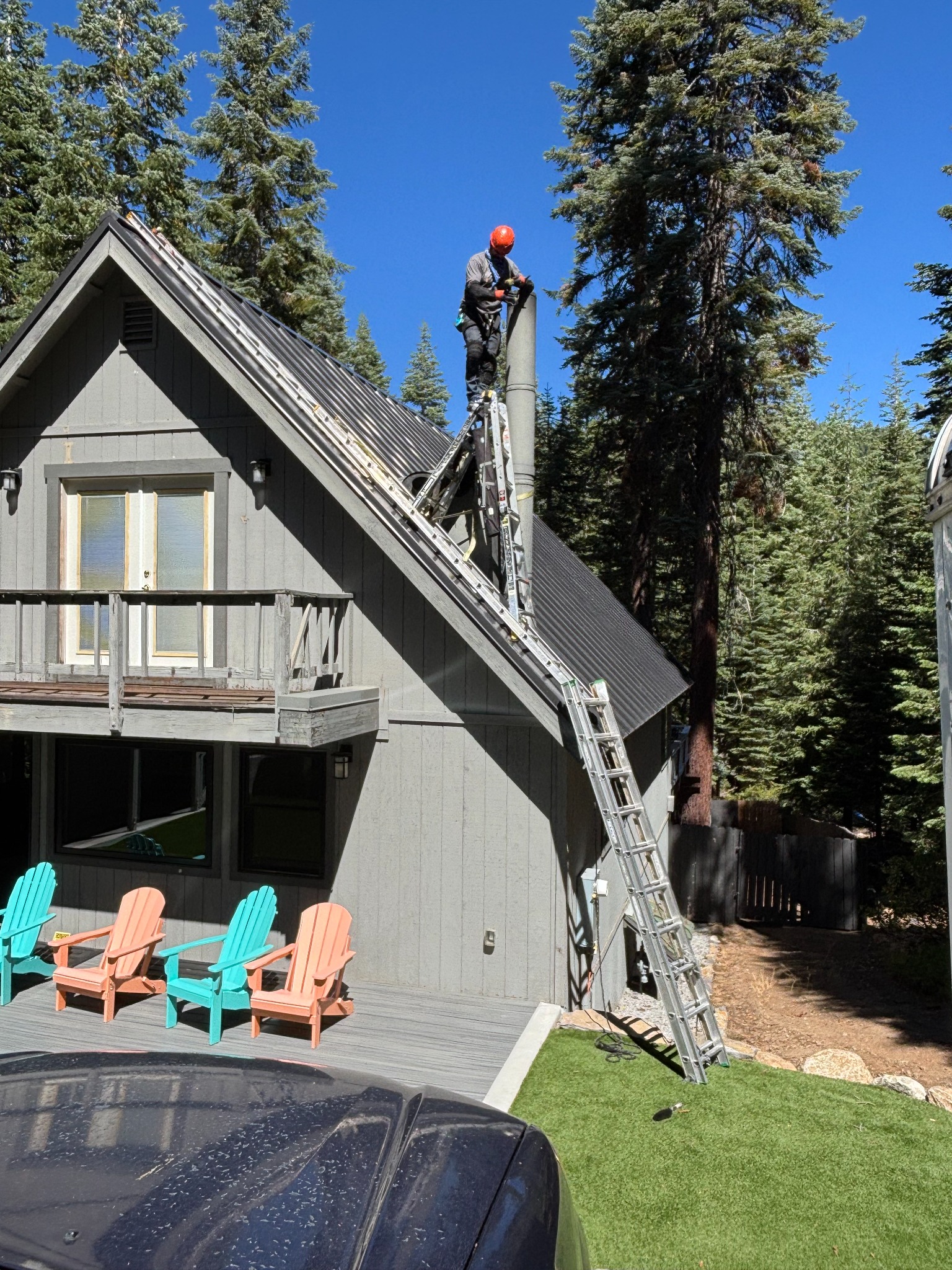 Roof and chimney access at a mountain home.